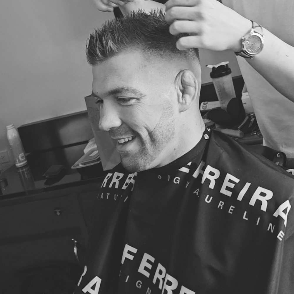 Image of Dricus Du Plessis showcasing his textured, matte-finish hairstyle at UFC 297 Toronto