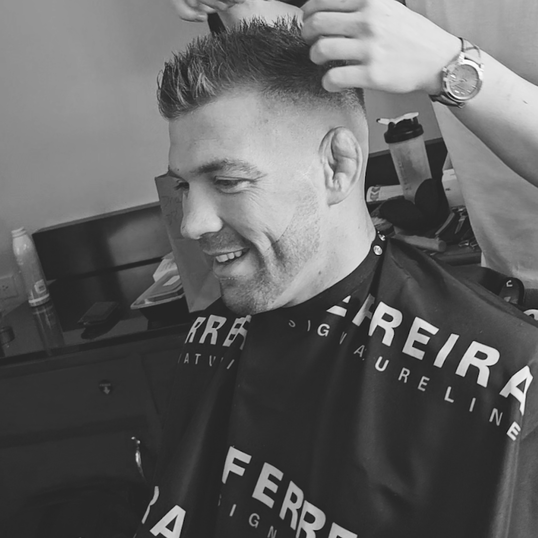 Image of Dricus Du Plessis showcasing his textured, matte-finish hairstyle at UFC 297 Toronto